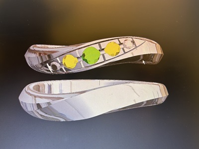 ジュエリーCADソフトの画面。完成した一対の結婚指輪の3Dモデル（ペアリング）が並んで表示されている。